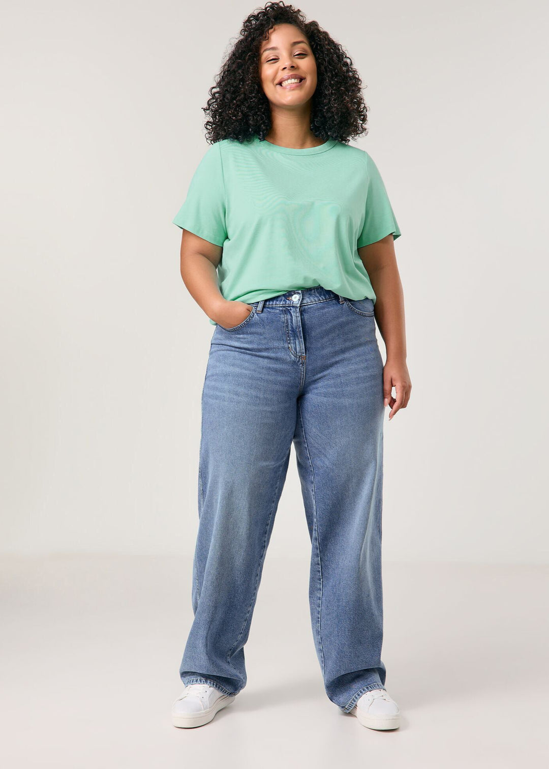 front view of plus size Samoon Carlotta Wide Leg Trouser Jean in Bleached Blue Denim on model