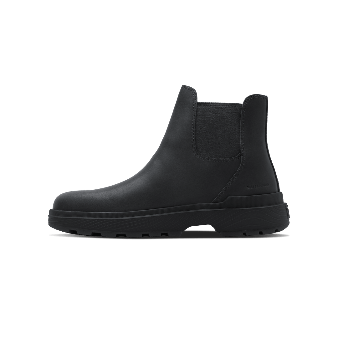 Black Chelsea boot with ankle-height upper and side elastic gore panel