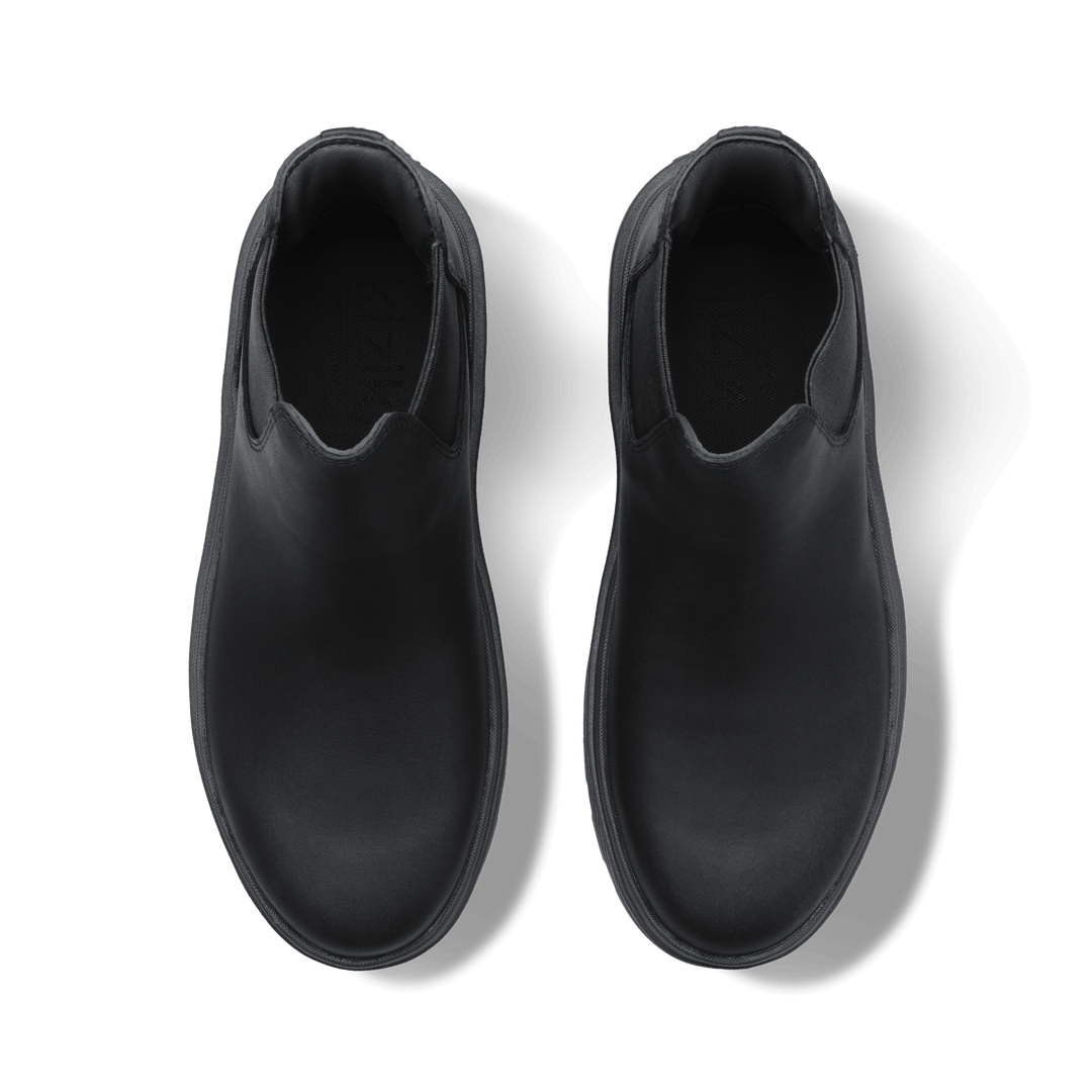 Black Chelsea boots interior view showing soft lining and smooth upper