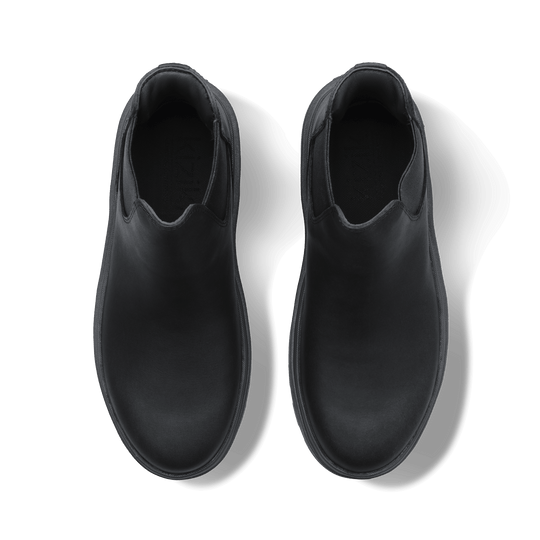 Black Chelsea boots interior view showing soft lining and smooth upper
