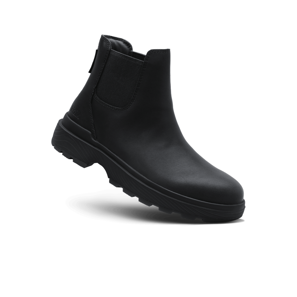 Black Chelsea boot profile view with elastic gore and cushioned tread outsole