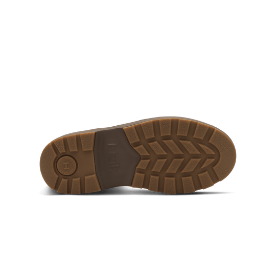 Outsole view of dark brown Kizik Sierra Chelsea boots with zigzag tread pattern.