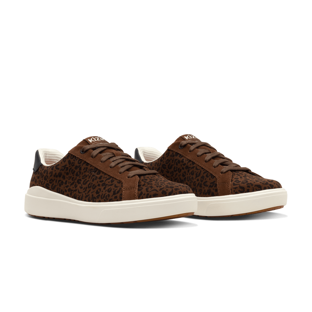 Pair of brown leopard print Kizik lace-up sneakers with white sole and black collar trim