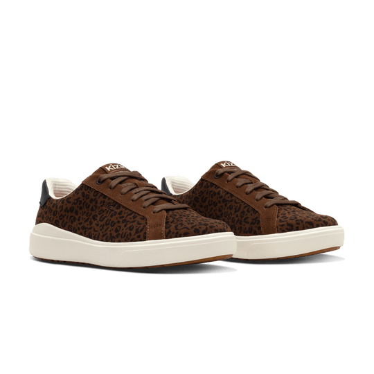 Pair of brown leopard print Kizik lace-up sneakers with white sole and black collar trim