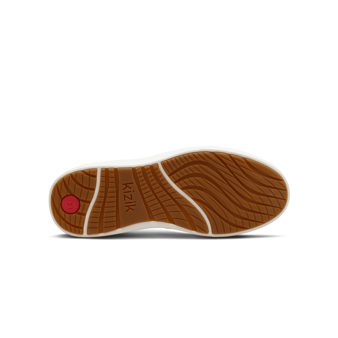 Kizik sneakers outsole with textured tread and brown rubber bottom